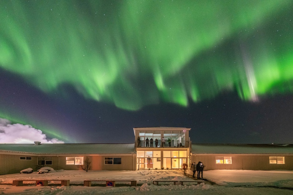 Northern Light Inn Building And Aurora Above It