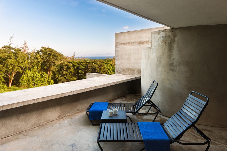 Triangular house concrete terrace with sea view