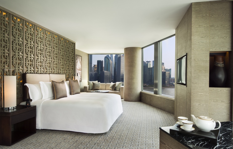 Banyan Tree Shanghai bedroom with city views