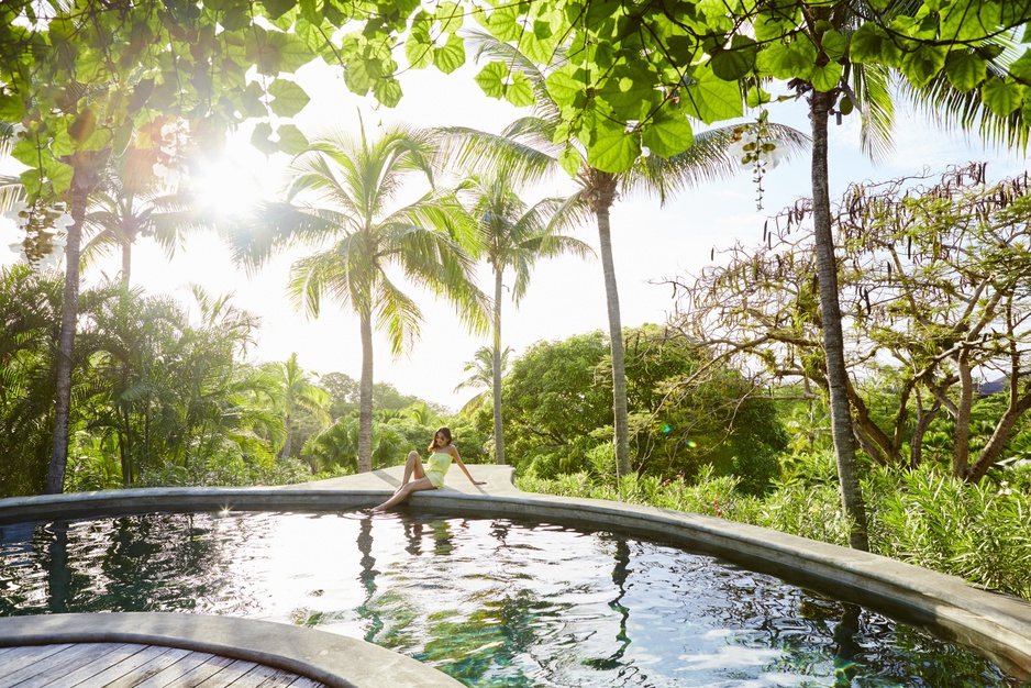 Girl in the jungle pool