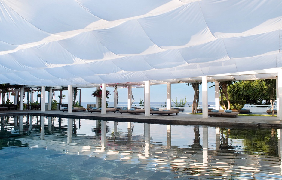 white curtains above the pool