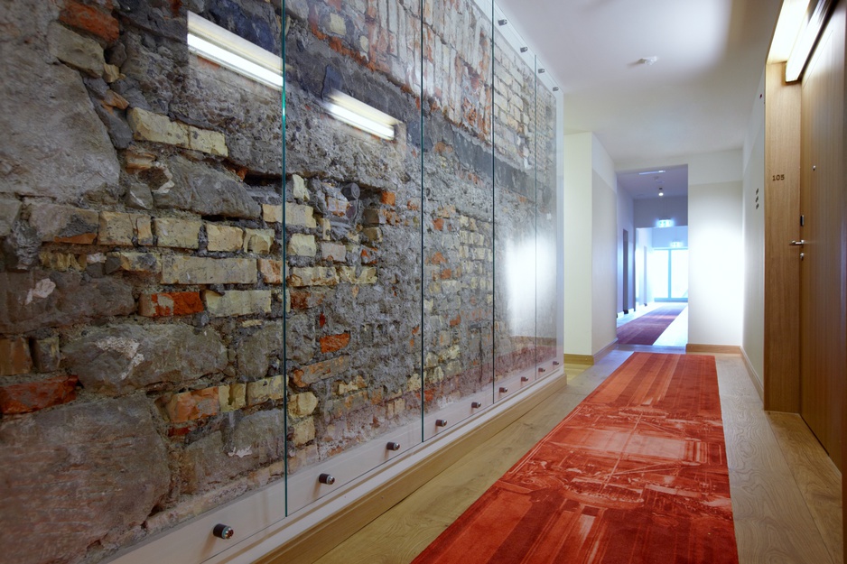 B2 Boutique Hotel corridor with visible concrete walls