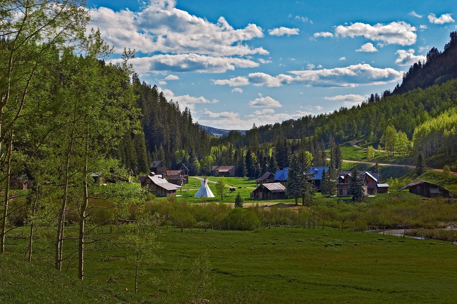 Dunton Hot Springs set in between green hills