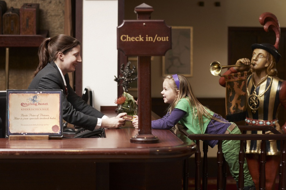 Kid checking in to hotel