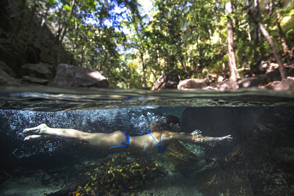 Bikini girl swimming under water