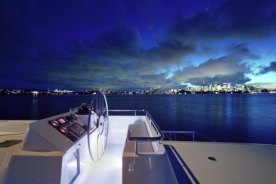 Necker Belle at night with city skyline