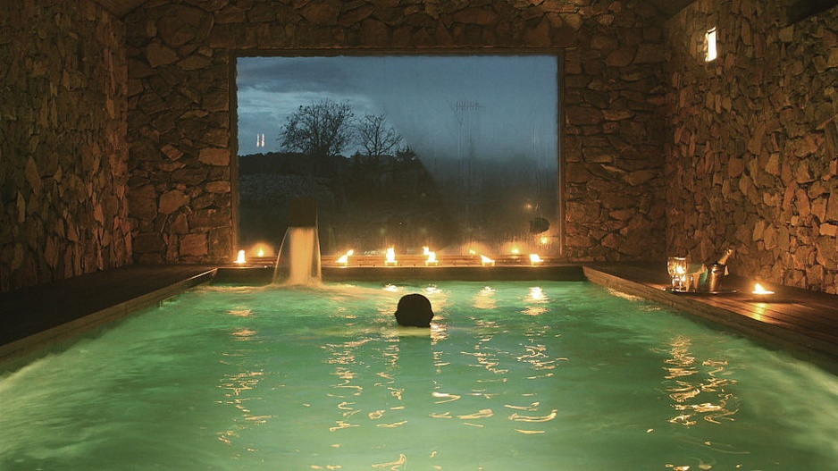 Inside swimming pool with view on the outside at Son Gener hotel