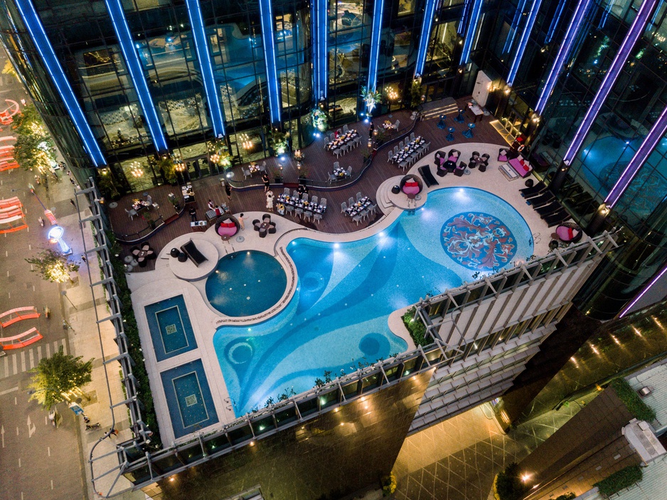 The Reverie Saigon Outdoor Terrace with a Pool