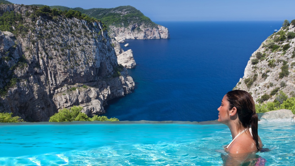 Girl in the pool with amazing views