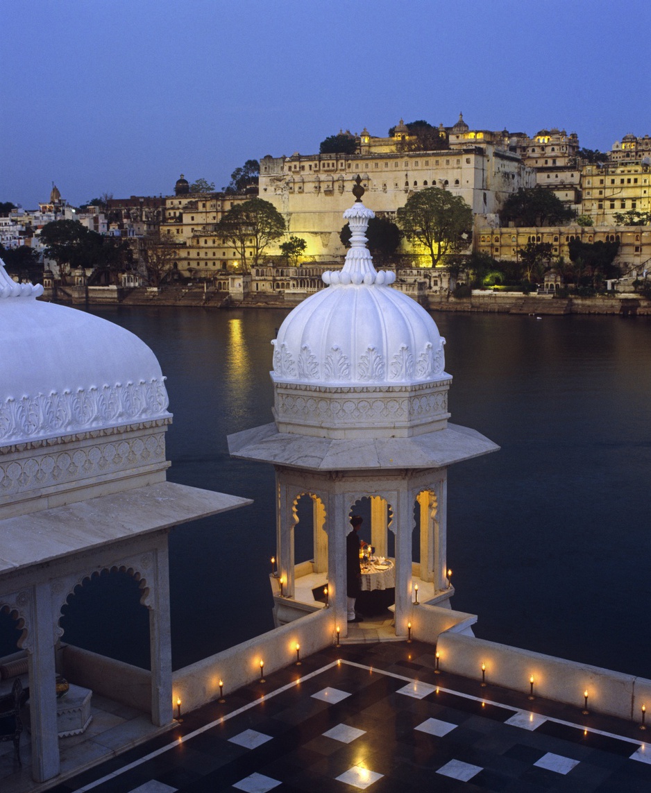 Lake Palace Hotel rooftop terrace at night with candles