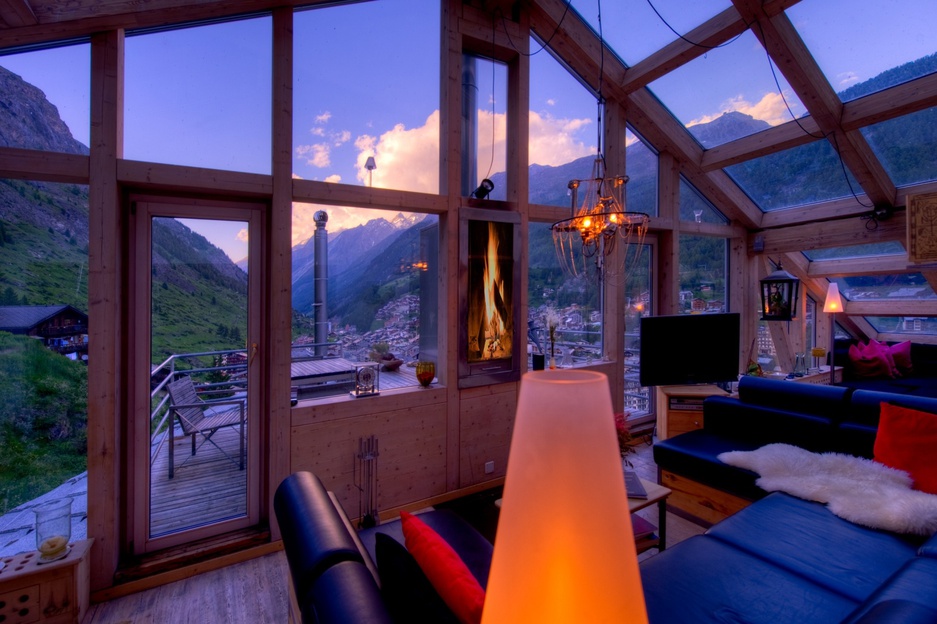 Heinz Julen Penthouse living room at night with Zermatt views