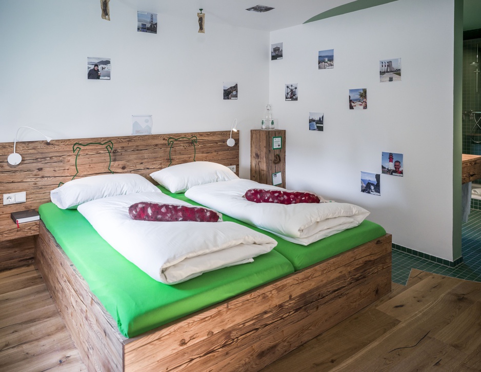 Bratwurst Hotel double room with a semi-open bathroom