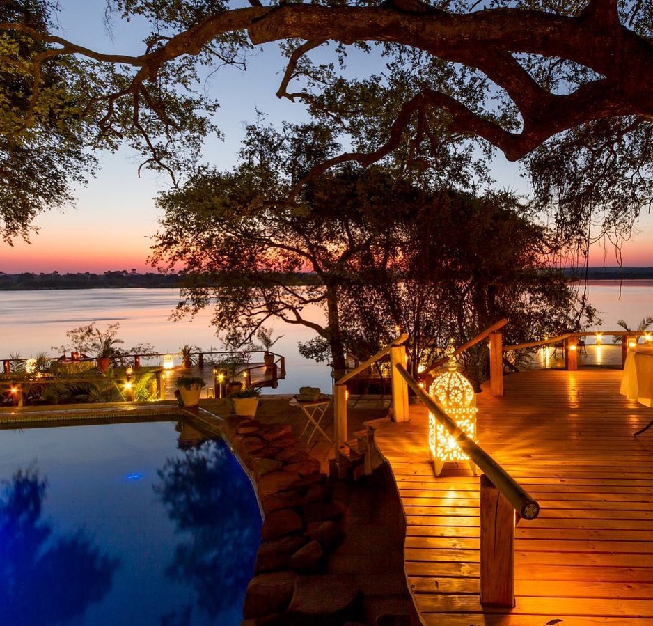 Tongabezi Lodge pool at night by the Zambezi River