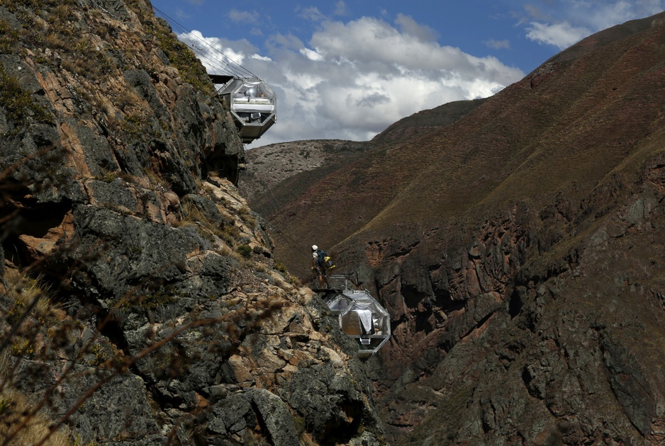 Climbing to the hanging capsules of Skylodge Adventure Suites