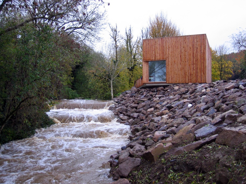 Glencomeragh Hermitages wooden hut next to the river