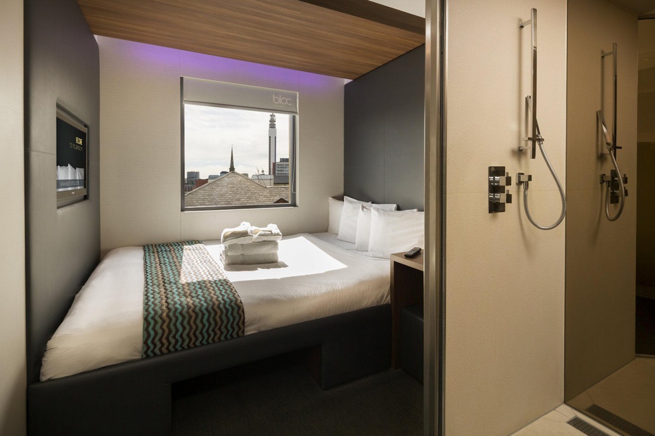 BLOC Hotel Birmingham bedroom with city view