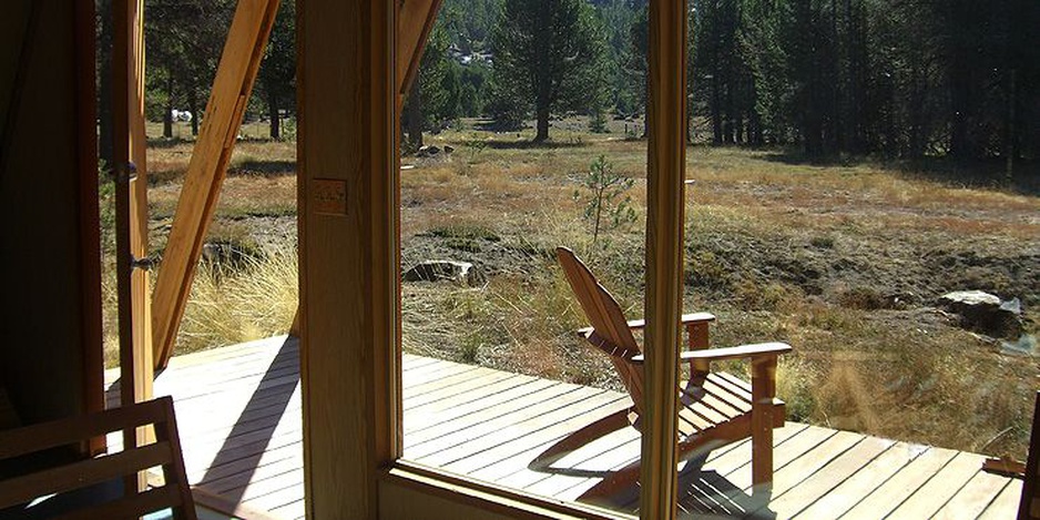 Terrace of a wooden cabin in the forest