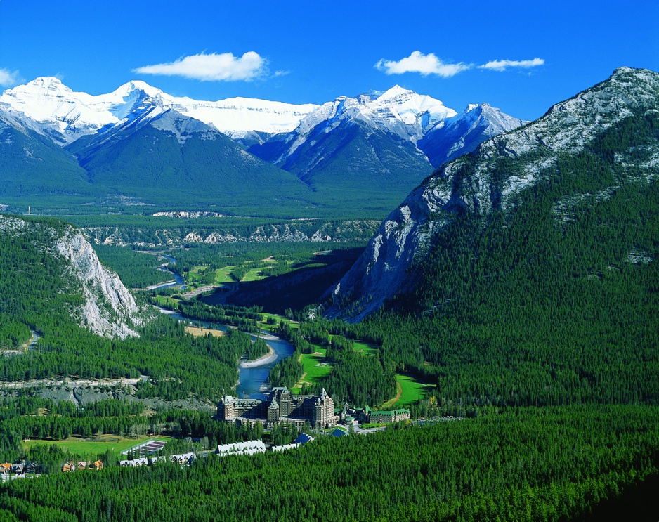 View of Banff nature with mountains and Fairmont Banff Springs Hotel