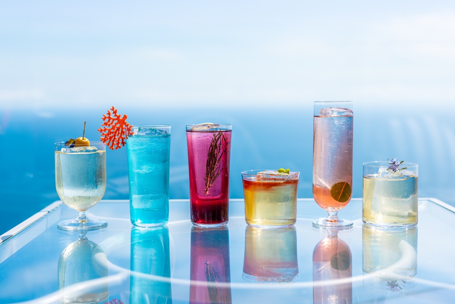 Wild, Colorful Cocktails With The Mediterranean Sea In The Background