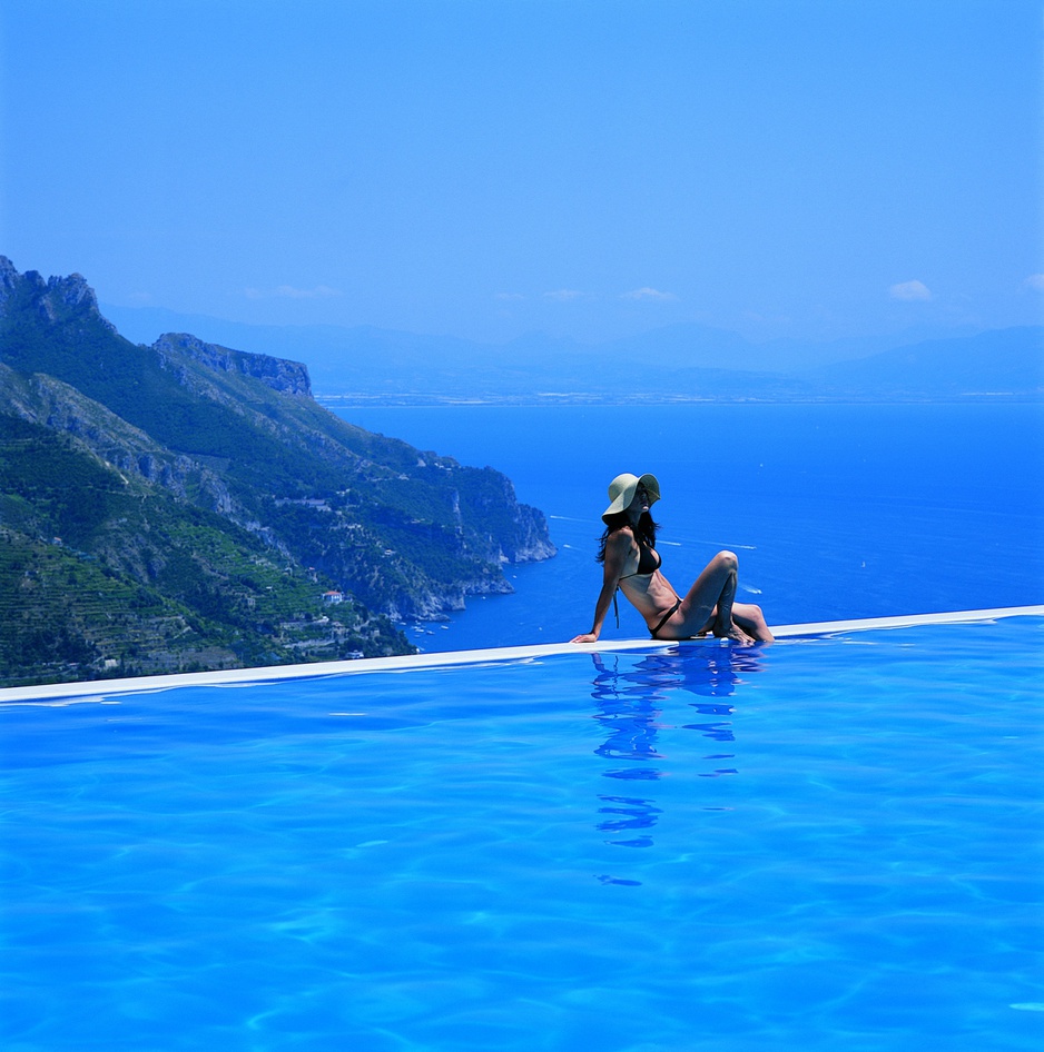 Girl at the edge of the infinity-pool