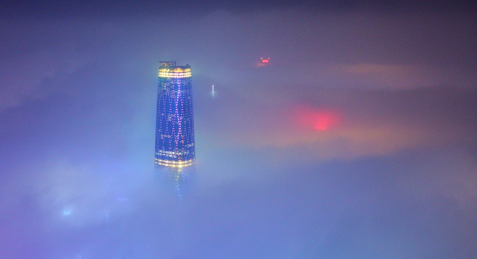 Four Seasons Hotel Guangzhou skyscraper above the clouds