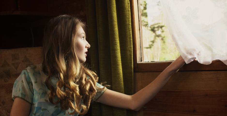 Beautiful girl looking out of the train window