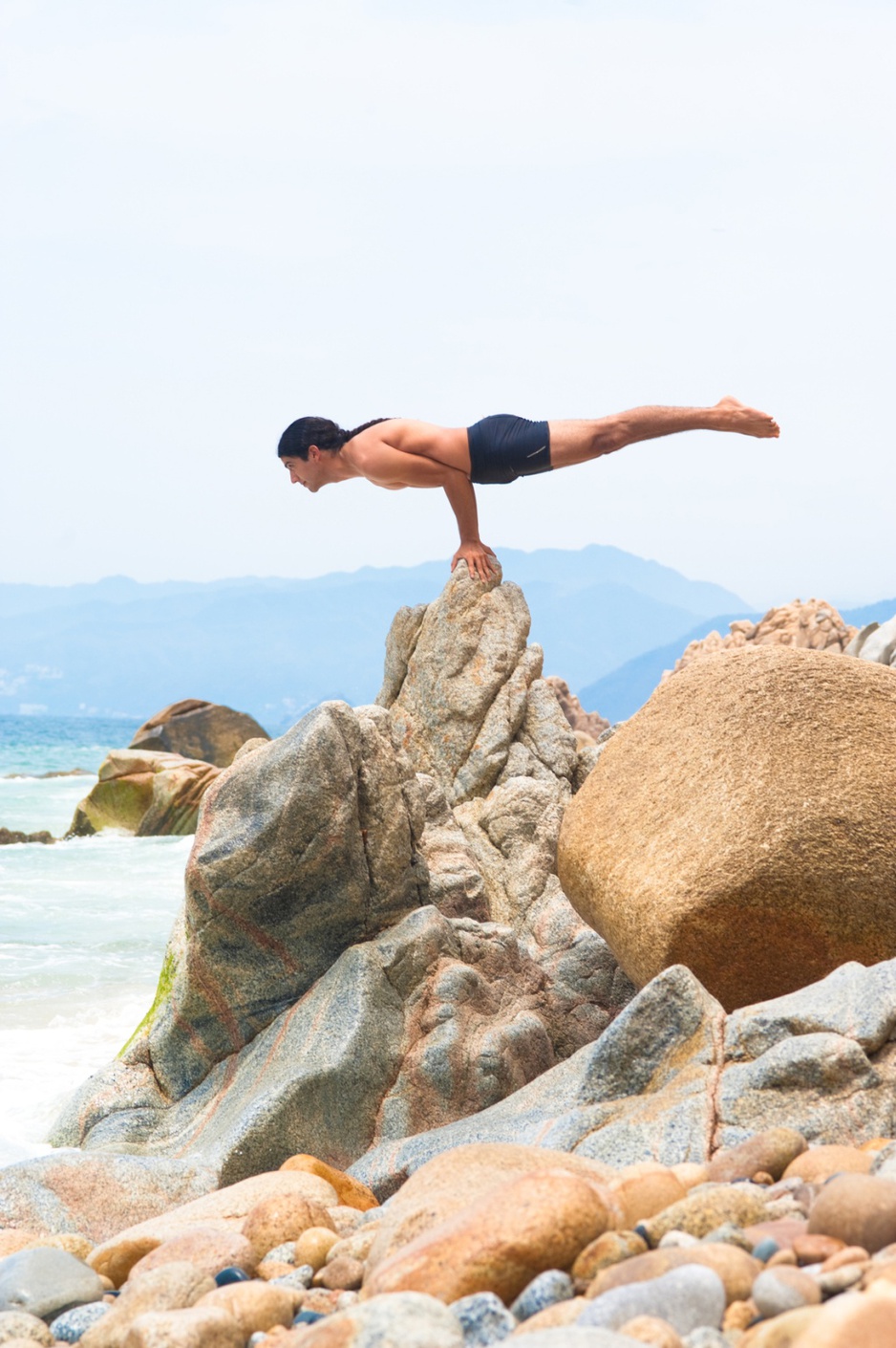 Extreme yoga on the beach