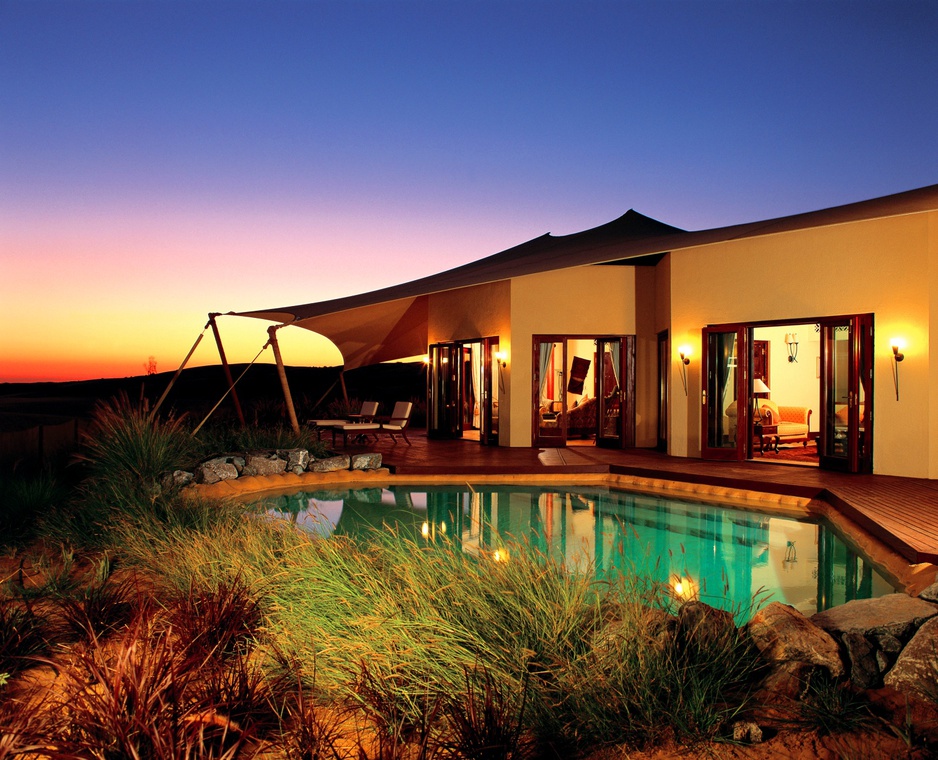 Al Maha Desert Resort tent pool at night