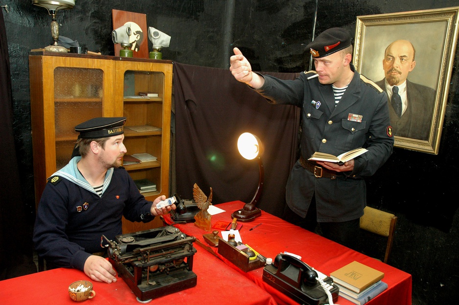 Karosta Prison, prison guards with Lenin picture in the background