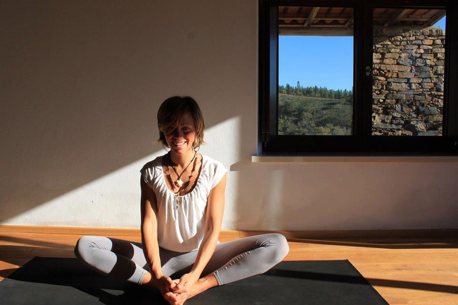 Blond girl doing yoga at Nespereira Estate