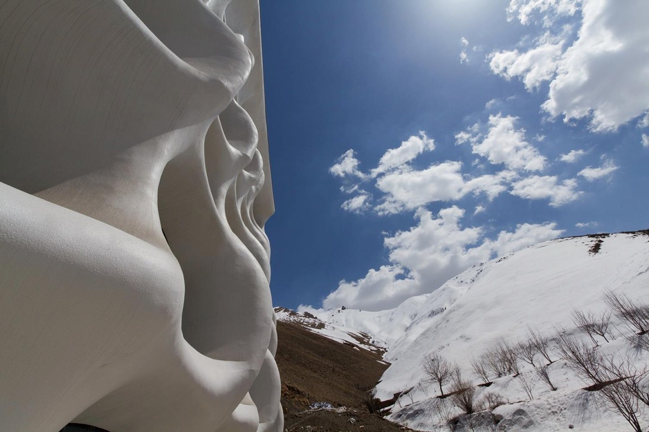 Barin Hotel facade with snowy mountains