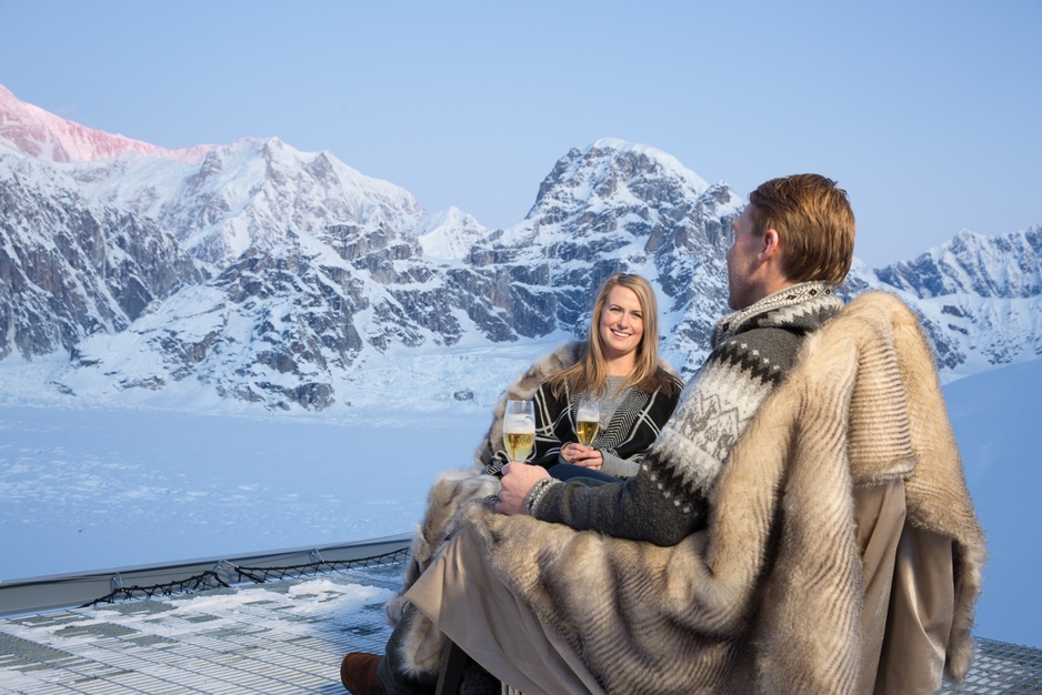 Sheldon Chalet Couple Enjoying Outdoor Champaign