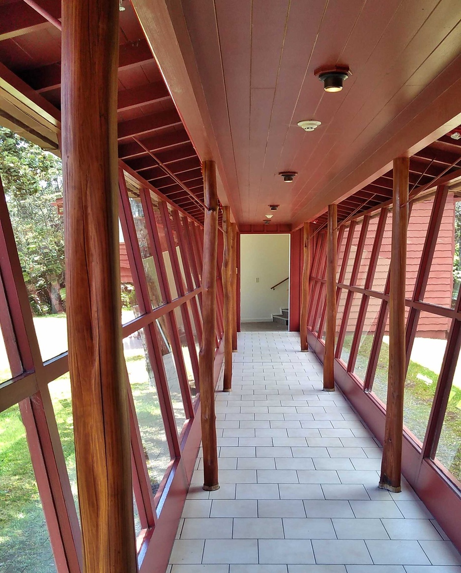 Walking down the glass hallway leads to the annex guest rooms