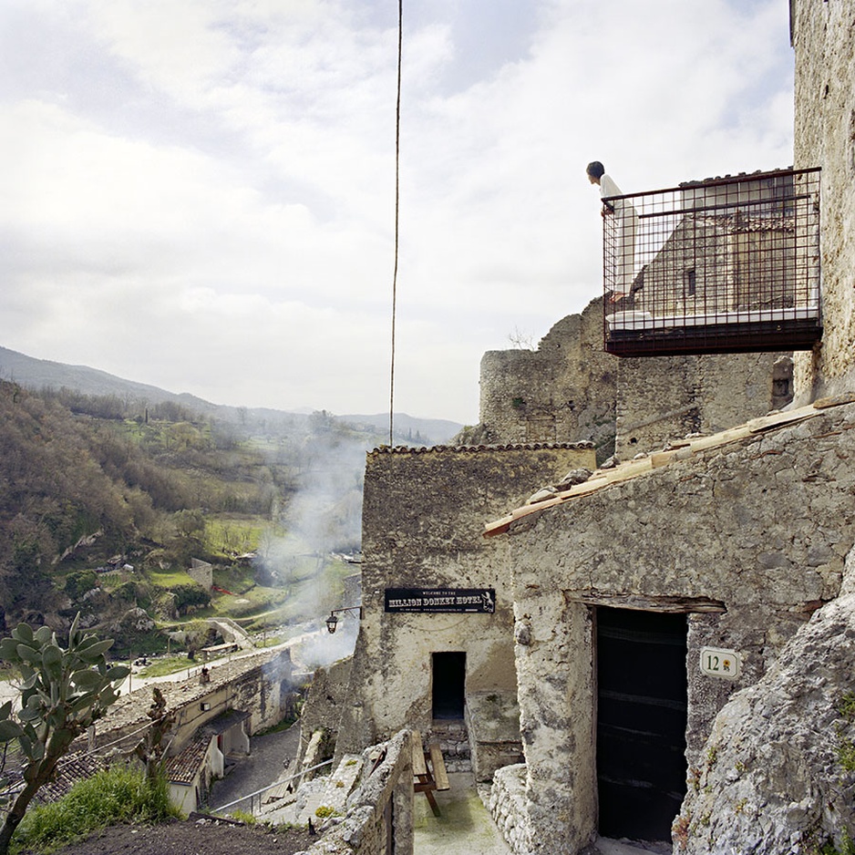 Million Donkey Hotel building with caves inside and the levitating cage room