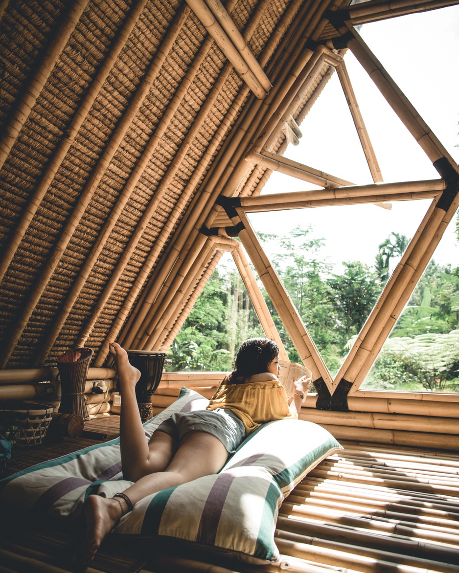 Girl laying in the Hideout Bali bamboo house