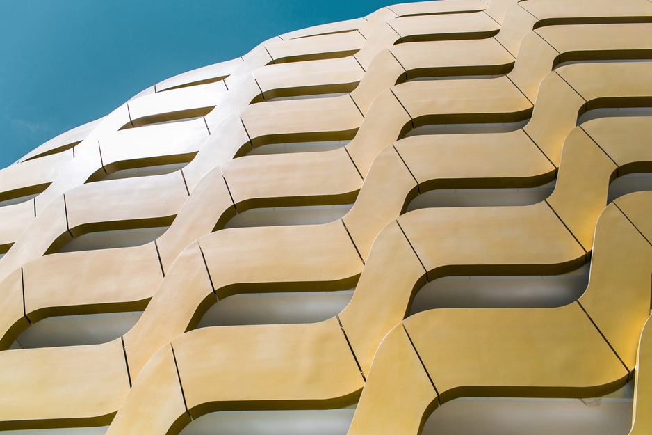 AlpenGold Hotel's Pinecone Inspired Golden Facade