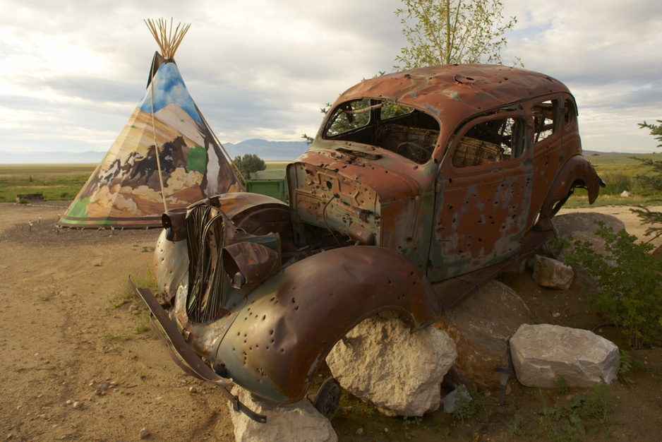 Rusty vintage car ruin at the tMustang Monument Resort