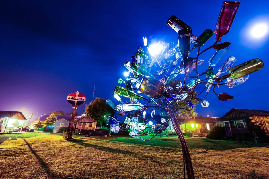 Shack Up Inn Garden Art Installation From Bottles