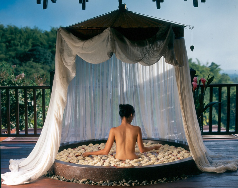 Naked Asian girl in a floral bath