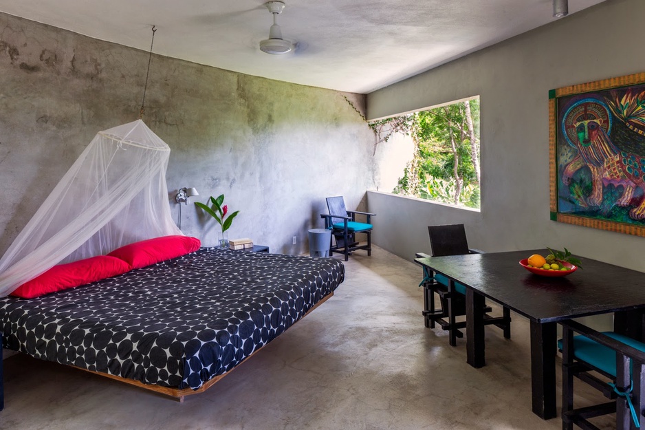 Triangular house bedroom with huge open window