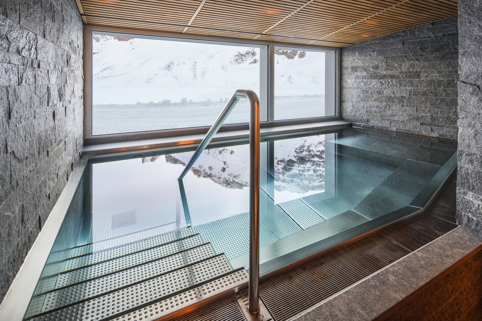 Frutt Family Lodge pool with snowy landscape view