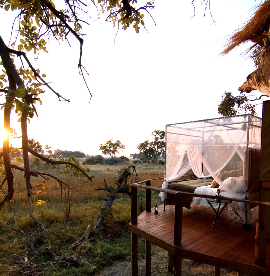 Sanctuary Baines Camp terrace with bed under the open sky