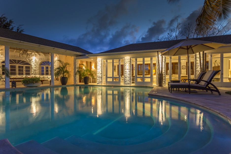 Mustique Island villa at night with pool