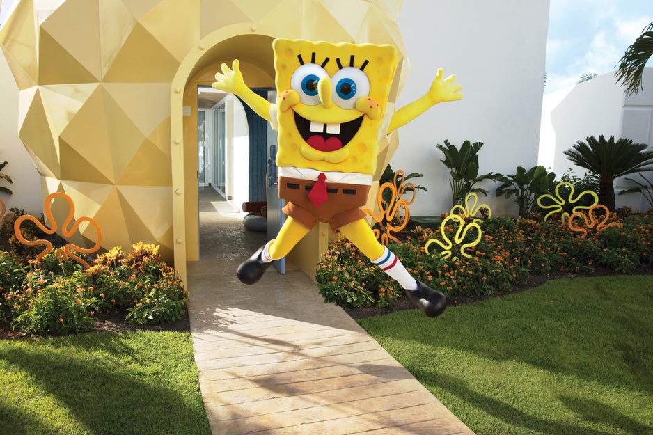 SpongeBob jumping in front of his Pineapple Villa