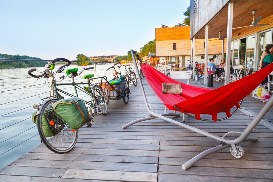 ArkaBarka Floating Hostel terrace with hammock and bikes