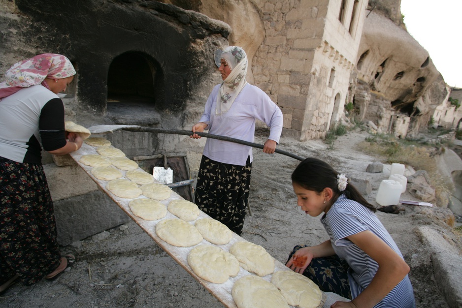 Women baking pita bread