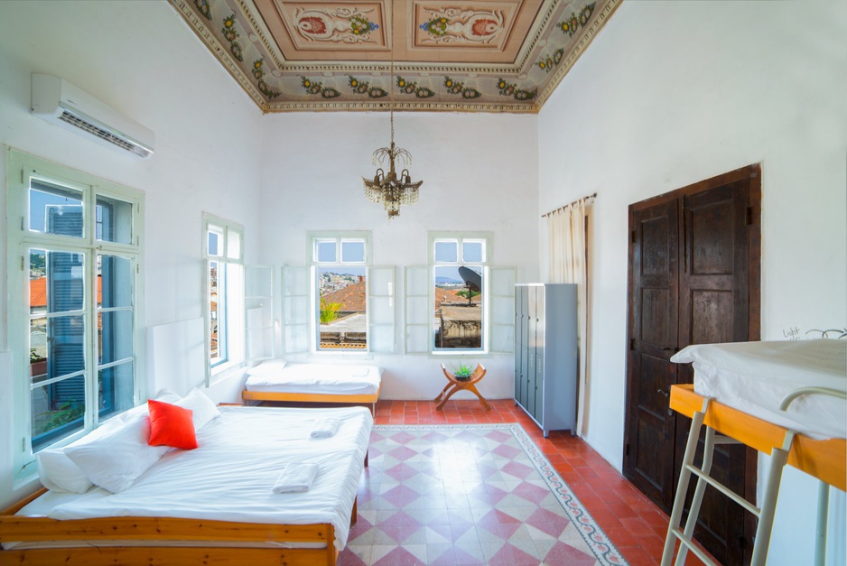 Fauzi Azar by Abraham Hostels Family Room With Decorated Ceiling And Windows All Around