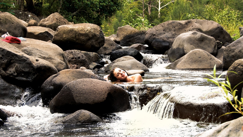 Girl bathing naked in the rapids