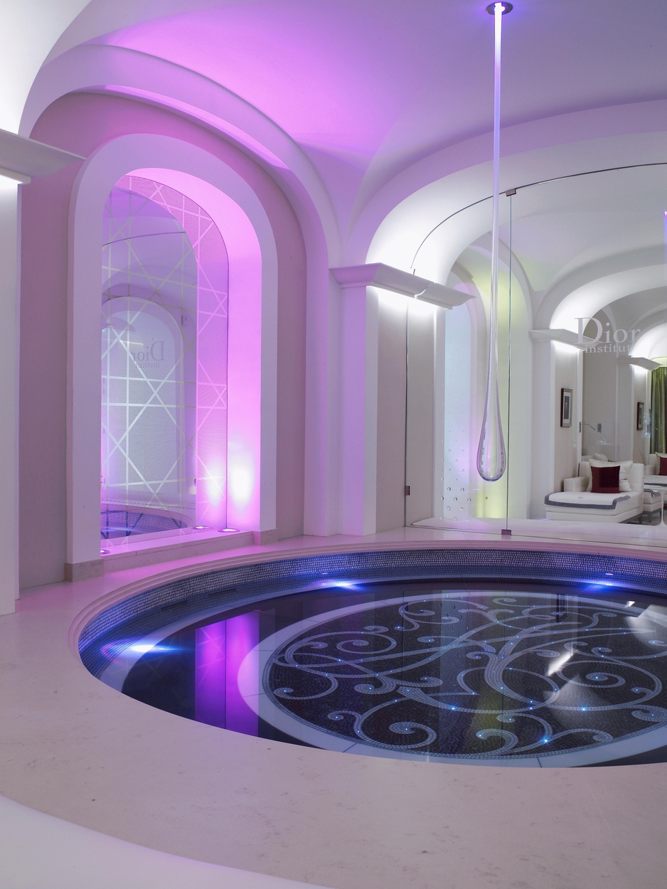 Hotel Plaza Athenee Paris lobby design details with pool and glass lamp