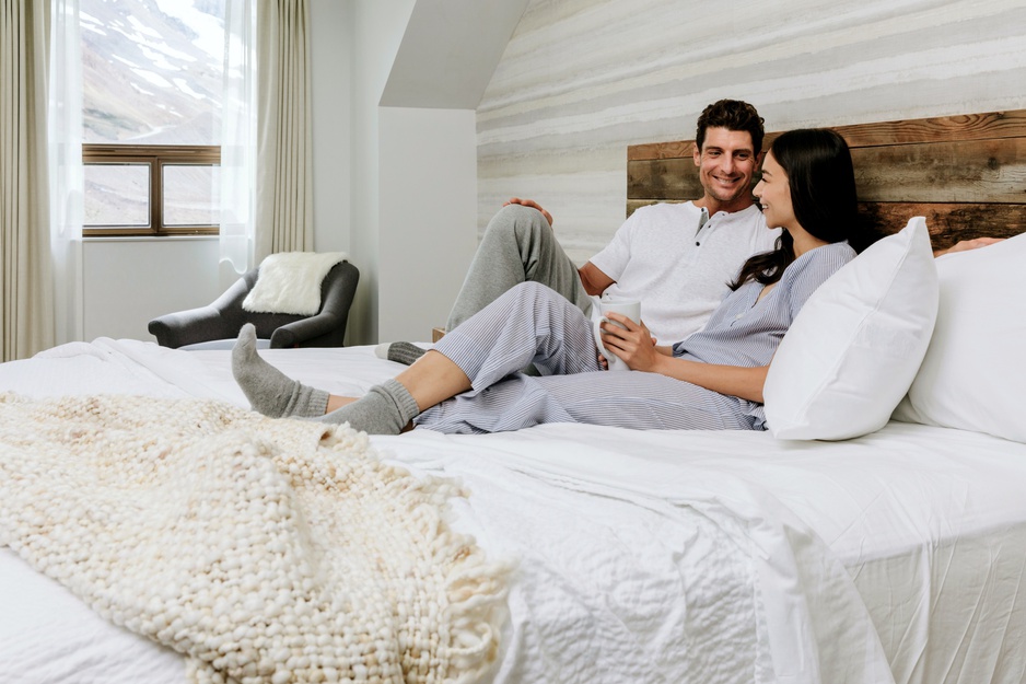 Couple In The Bed At The Glacier View Lodge